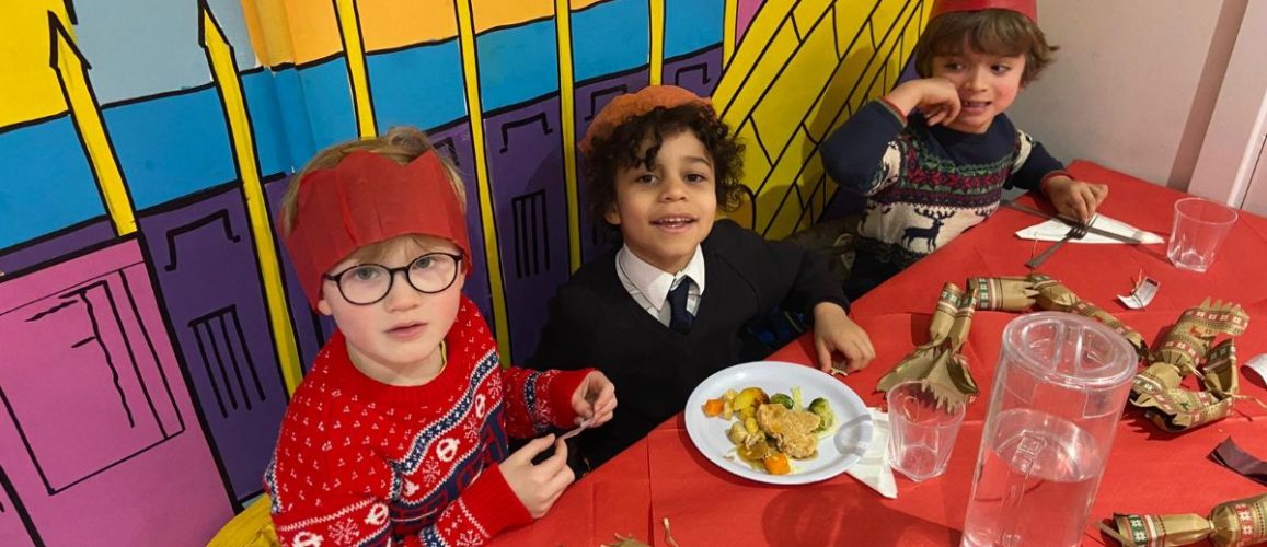 group of young boys eating Christmas dinner