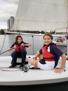 two girls in a sail boat