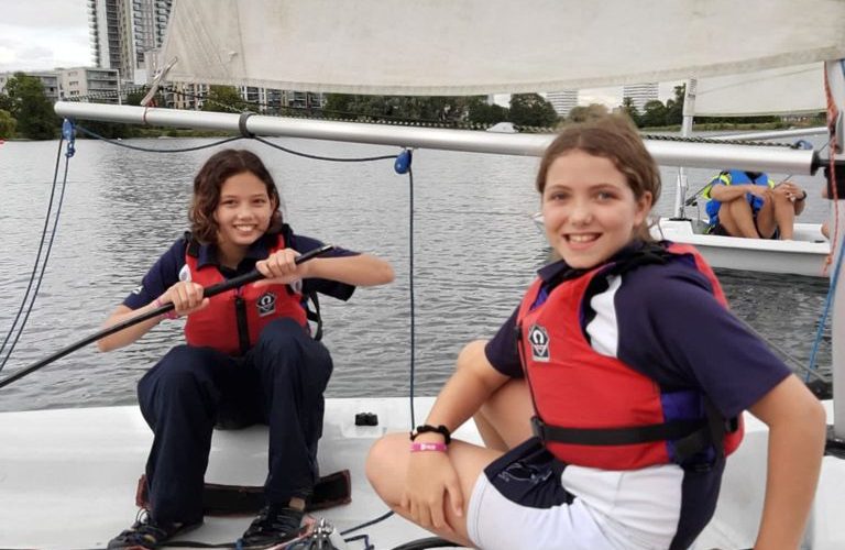 two girls in a sail boat