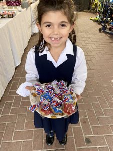 child holding her selection of biscuits