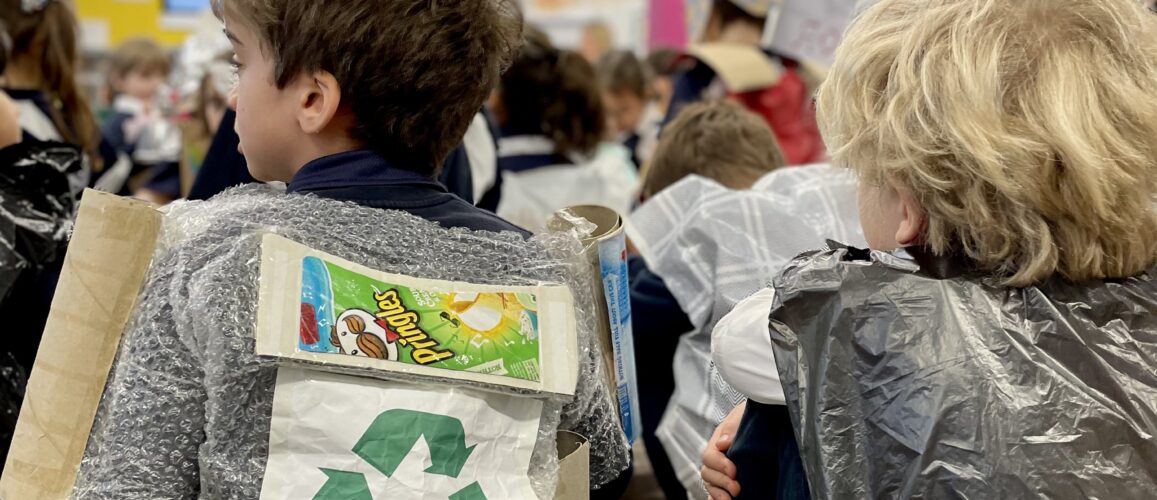 students wearing recycled materials on their bodies