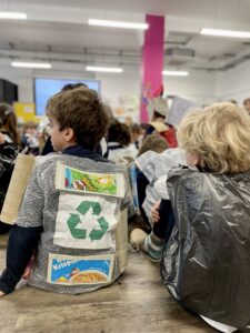 students wearing recycled materials on their bodies