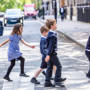 students walking over the crossing