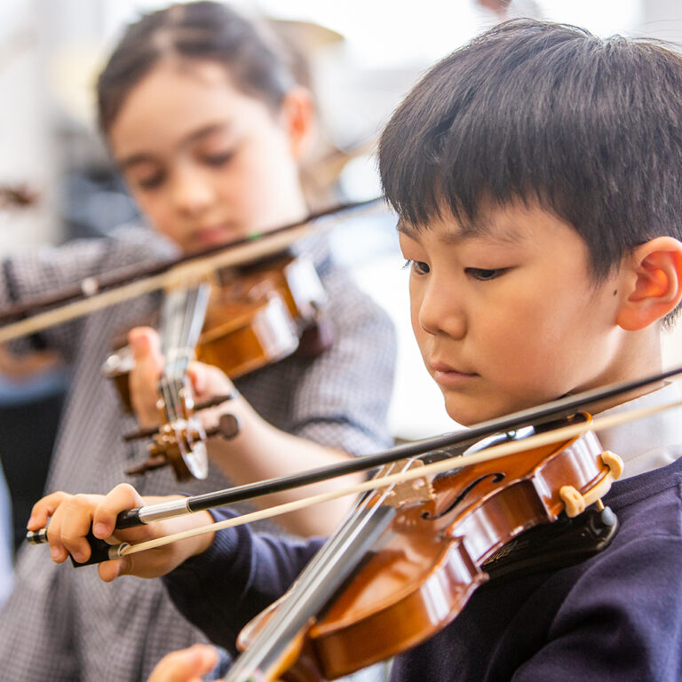 students playing violins