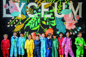 students stood by a painted wall - reception curriculum