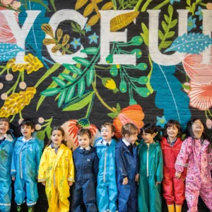 Pupils at the Lyceum School, a leading London independent school, standing before the school signage.